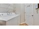 Convenient laundry room with washer, dryer, and shelving at 1731 Pryor Sw Rd # 104, Atlanta, GA 30315