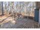 Spacious wooden back deck overlooking a wooded area at 215 Silver Creek Ln, Stockbridge, GA 30281