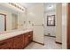Bathroom with wood vanity, tile floor, and shower at 215 Silver Creek Ln, Stockbridge, GA 30281