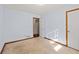 Bright bedroom featuring neutral walls and carpet at 215 Silver Creek Ln, Stockbridge, GA 30281