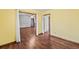 Bright dining room with hardwood floors, adjacent to living room at 215 Silver Creek Ln, Stockbridge, GA 30281