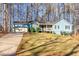 Ranch style home with attached garage, and a spacious front yard at 215 Silver Creek Ln, Stockbridge, GA 30281