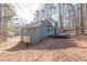 Side view of the house showcasing the garage and trampoline at 215 Silver Creek Ln, Stockbridge, GA 30281