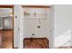 Laundry room with wire shelving and wood-look flooring at 215 Silver Creek Ln, Stockbridge, GA 30281