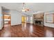 Large living room featuring hardwood floors and a stone fireplace at 215 Silver Creek Ln, Stockbridge, GA 30281