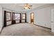 Large main bedroom with high ceilings and ceiling fan at 215 Silver Creek Ln, Stockbridge, GA 30281