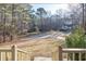 View from porch of wooded backyard and neighborhood at 215 Silver Creek Ln, Stockbridge, GA 30281
