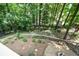 Large backyard with a wooded area and a storage shed at 4848 Green Forest Nw Ct, Acworth, GA 30102