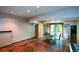Spacious basement recreation area with a table and chairs, and access to the outside at 4848 Green Forest Nw Ct, Acworth, GA 30102