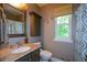 Clean bathroom with granite vanity, updated fixtures, and a window for natural light at 4848 Green Forest Nw Ct, Acworth, GA 30102
