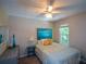 Cozy bedroom with a ceiling fan and a view of the backyard from the window at 4848 Green Forest Nw Ct, Acworth, GA 30102