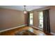 Dining room with hardwood floors, large windows, and neutral walls at 4848 Green Forest Nw Ct, Acworth, GA 30102