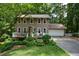 Two-story house with deck, attached garage, and landscaped yard at 4848 Green Forest Nw Ct, Acworth, GA 30102