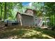 Exterior of house showcasing a large backyard and wooded area at 4848 Green Forest Nw Ct, Acworth, GA 30102