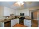 Bright eat-in kitchen, featuring granite countertops, stainless steel appliances, and ample cabinet space at 4848 Green Forest Nw Ct, Acworth, GA 30102