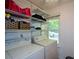 Laundry area with washer, dryer, and ample shelving for storage at 4848 Green Forest Nw Ct, Acworth, GA 30102