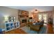 Living room featuring a stone fireplace and hardwood floors at 4848 Green Forest Nw Ct, Acworth, GA 30102