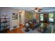 Living room with hardwood floors, comfy seating, and access to deck at 4848 Green Forest Nw Ct, Acworth, GA 30102