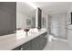 Stylish bathroom with a marble shower, modern fixtures, and vanity with storage at 2660 Peachtree Nw Rd # 25H, Atlanta, GA 30305