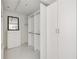 Spacious walk-in closet with custom shelving and ample storage at 2660 Peachtree Nw Rd # 25H, Atlanta, GA 30305
