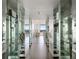 Mirrored hallway leading into a spacious and well-lit living area with great views at 2660 Peachtree Nw Rd # 25H, Atlanta, GA 30305