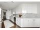 Modern kitchen featuring sleek white cabinetry, subway tile, and stainless steel appliances at 2660 Peachtree Nw Rd # 25H, Atlanta, GA 30305