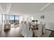 Elegant living and dining area with hardwood floors, neutral tones, and city views at 2660 Peachtree Nw Rd # 25H, Atlanta, GA 30305