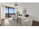 Bright living room features floor-to-ceiling windows and a neutral color palette at 2660 Peachtree Nw Rd # 25H, Atlanta, GA 30305