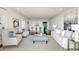Spacious living room with neutral color palette, hardwood floors, and stylish decor at 2660 Peachtree Nw Rd # 25H, Atlanta, GA 30305