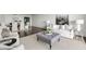 Open-concept living area with stylish furniture, hardwood floors, and inviting atmosphere at 2660 Peachtree Nw Rd # 25H, Atlanta, GA 30305