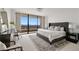 Luxurious main bedroom with floor-to-ceiling windows and plush furnishings at 2660 Peachtree Nw Rd # 25H, Atlanta, GA 30305