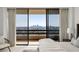 Main bedroom with large windows offers abundant natural light and city views at 2660 Peachtree Nw Rd # 25H, Atlanta, GA 30305