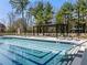 A stunning swimming pool with lounge chairs and a pergola, perfect for relaxation and enjoying the outdoors at 2660 Peachtree Nw Rd # 25H, Atlanta, GA 30305