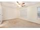 Bright bedroom with neutral walls and ceiling fan at 3712 Berkeley Xing, Duluth, GA 30096