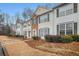 Charming townhomes feature well-maintained landscaping and classic architectural details at 3712 Berkeley Xing, Duluth, GA 30096