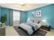 Comfortable bedroom featuring a ceiling fan, large window, and stylish decor at 64 Devon Ln, Avondale Estates, GA 30002