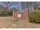 Avondale Estates brick community sign with landscaping, on a sunny day at 64 Devon Ln, Avondale Estates, GA 30002