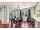 Dining area with hardwood floors, views to outside, and pendant lighting at 64 Devon Ln, Avondale Estates, GA 30002