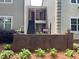 Exterior view of unit with brick facade and steps to the second floor entrance at 64 Devon Ln, Avondale Estates, GA 30002