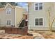Townhome exterior with painted siding and stairs leading to entry at 64 Devon Ln, Avondale Estates, GA 30002