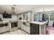 Modern kitchen with stainless steel appliances, a farmhouse sink, and lots of natural light at 64 Devon Ln, Avondale Estates, GA 30002