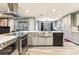 Bright kitchen featuring stainless appliances, a breakfast bar and views to the deck at 64 Devon Ln, Avondale Estates, GA 30002