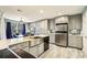 Charming kitchen with gray cabinets, stainless steel appliances, and bright natural light at 64 Devon Ln, Avondale Estates, GA 30002