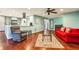 Open living area with updated kitchen and hardwood flooring, filled with natural light at 64 Devon Ln, Avondale Estates, GA 30002