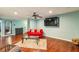 Comfortable living room with a modern ceiling fan, hardwood floors, and neutral-toned walls at 64 Devon Ln, Avondale Estates, GA 30002