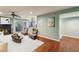 Open concept living area with a fireplace, wood floors, and access to a balcony at 64 Devon Ln, Avondale Estates, GA 30002