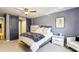Bedroom featuring sliding barn doors and large bed at 64 Devon Ln, Avondale Estates, GA 30002