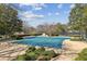 Community swimming pool with trees surrounding it, waiting for the summer season at 64 Devon Ln, Avondale Estates, GA 30002