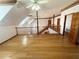 Open bonus room with hardwood floors and a view of the second floor at 10995 Parsons Rd, Johns Creek, GA 30097