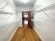 Walk-in closet with wire shelving providing ample storage at 10995 Parsons Rd, Johns Creek, GA 30097